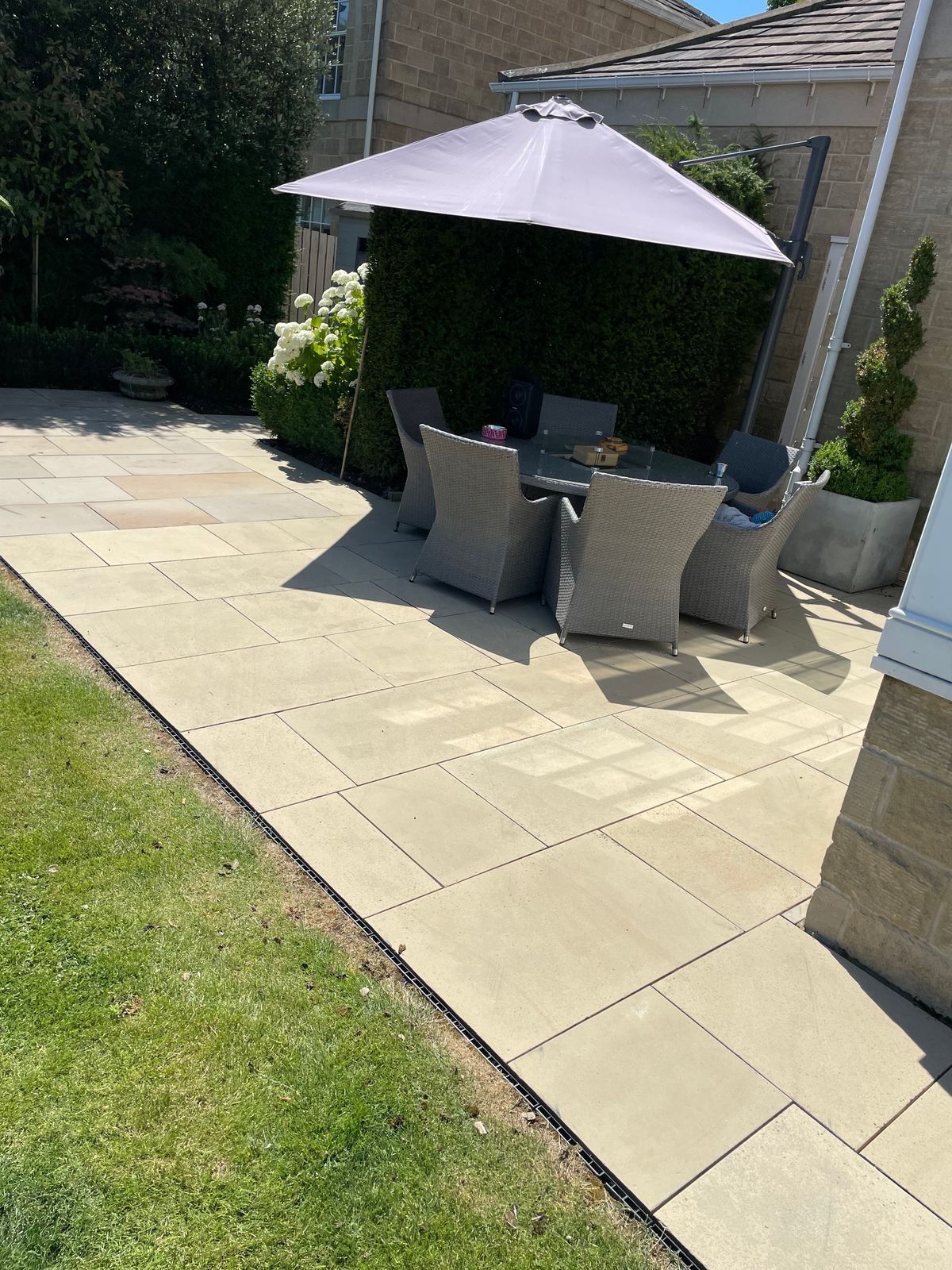 A beautifully cleaned patio with garden furniture