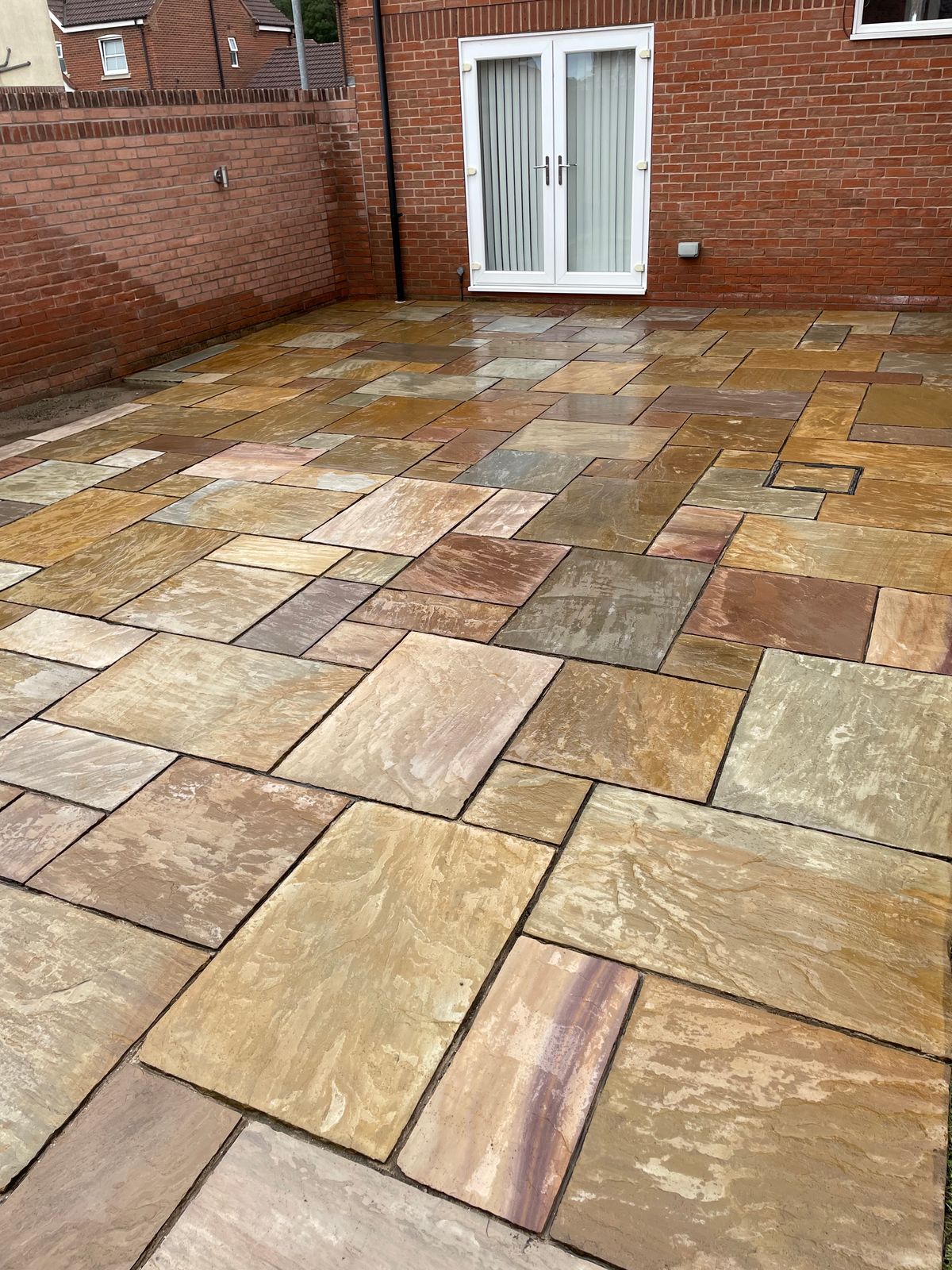 Freshly pressure washed Indian sandstone patio
